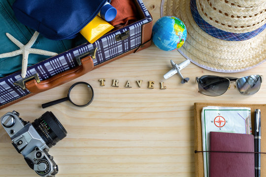 Outfit of traveler on wooden background