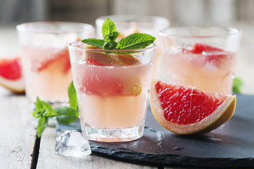 Pink cocktail with ice and mint
