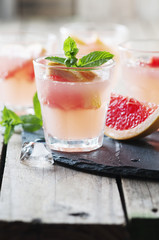 Pink cocktail with ice and mint