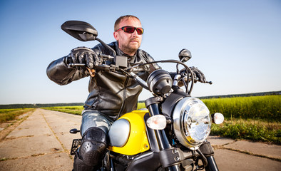 Fototapeta na wymiar Biker on a motorcycle