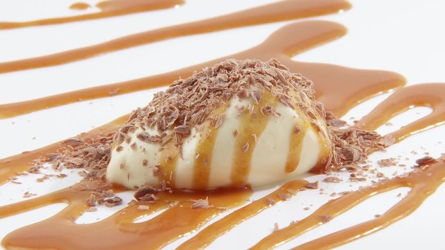 White chocolate mousse with caramel sauce & grated chocolate