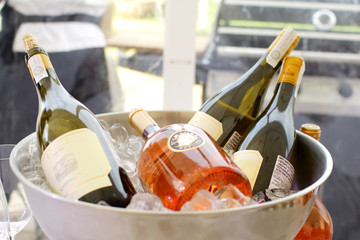 cooled wine bottle in ice cubes