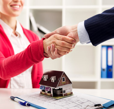 House rent and insurance agreement. Customer and agent shaking hands