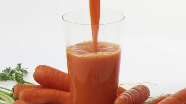 Carrots and freshly pressed carrot juice