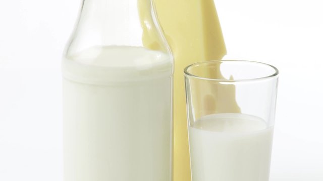 Emmental cheese, bottle of milk and glass of milk