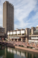 Naklejka premium Barbican Centre, London. Lakeside view of the landmark London arts venue with its Brutalist concrete architecture.