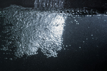 Water flowing on the glass wall.