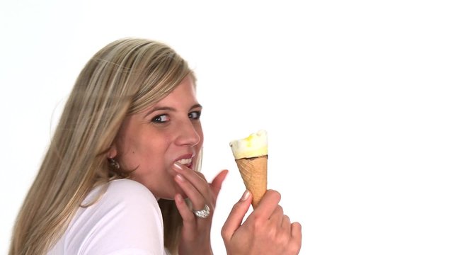 Blond woman licking an ice cream