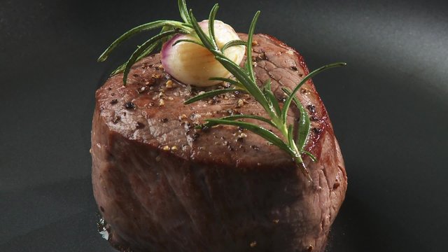 Frying beef fillet in a frying pan