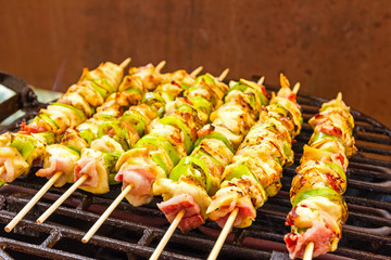 BBQ barbecuing skewers, grill with vegetable skewer - close up.
