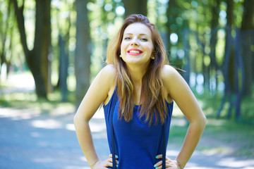 beautiful girl in a park smiling