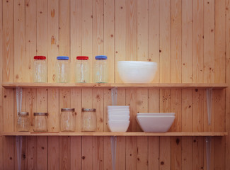 Fototapeta na wymiar Kitchen utensils on shelves