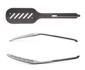 Used black plastic spatula isolated