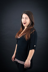 Beautiful woman doing different expressions in different sets of clothes: blinking