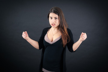 Beautiful woman doing different expressions in different sets of clothes: angry
