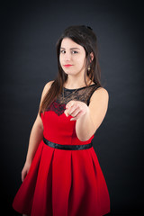 Fototapeta premium Beautiful woman doing different expressions in different sets of clothes: pointing