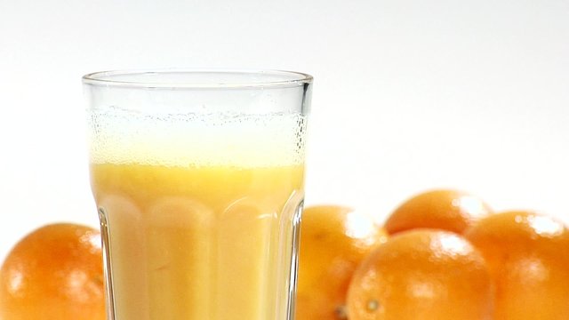 Pouring orange juice into a glass
