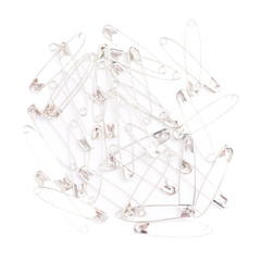 Fototapeta premium Surface covered with multiple safety pins isolated on white
