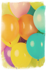 Colorful balloons on green background