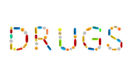 The word Drugs made with pills isolated on white