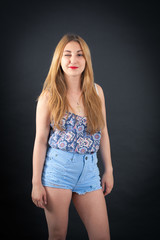 Fototapeta premium Beautiful girl doing different expressions in different sets of clothes: blinking