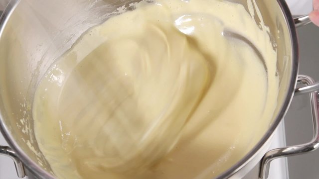 Whisking zabaglione until pale and fluffy