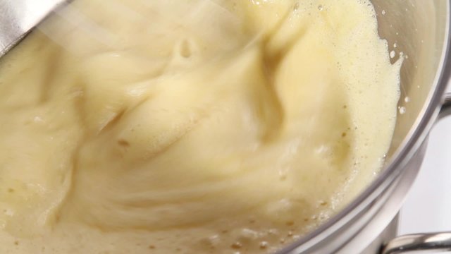 Whisking zabaglione until pale and fluffy