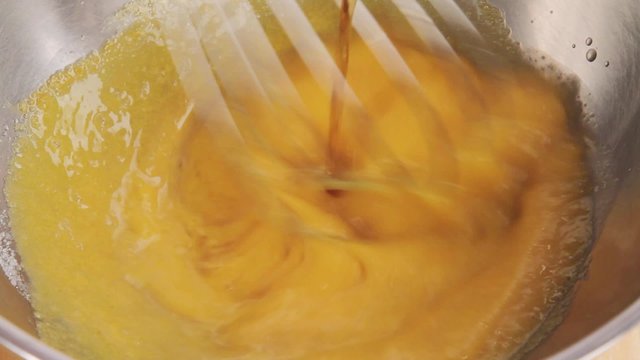 Whisking together egg yolks and sugar