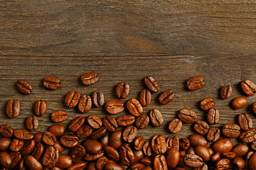 Coffee beans on wooden background