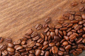Coffee beans on wooden background
