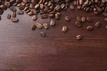 Coffee beans on wooden background