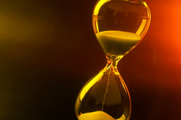 Hourglass on dark color background