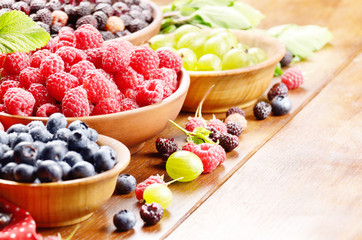 Wooden bowls with organic berries