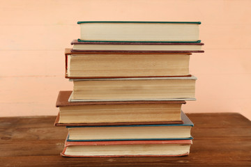Stack of books on wooden background