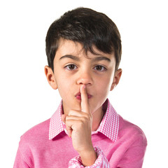 Boy making silence gesture