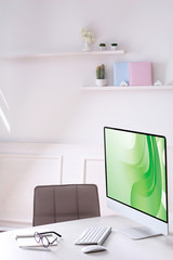 Workplace with computer in room