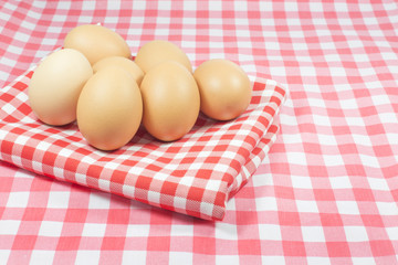 Eggs on pink color plaid  and red color plaid