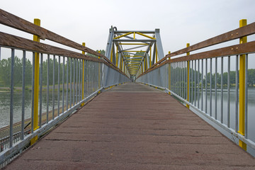 Footbridge over a river in summer