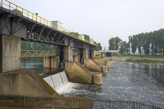 Weir across a river to regulate its flow