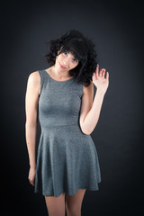 Beautiful woman doing different expressions in different sets of clothes: waving