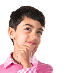 Kid thinking over white background
