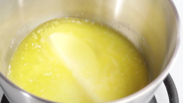 Butter being melted in a saucepan