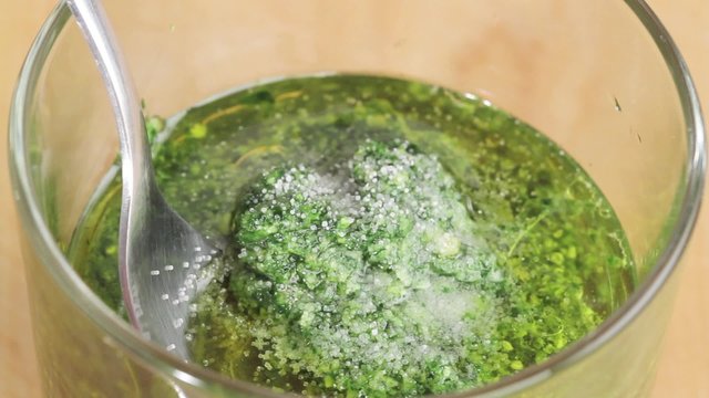 Salt being added to pesto