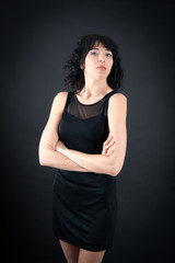 Fototapeta premium Beautiful woman doing different expressions in different sets of clothes: arms crossed