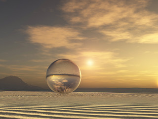Esfera de cristal en un paisaje desértico