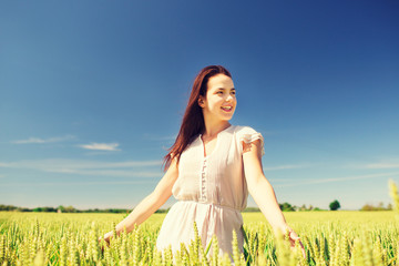 smiling young woman on cereal field