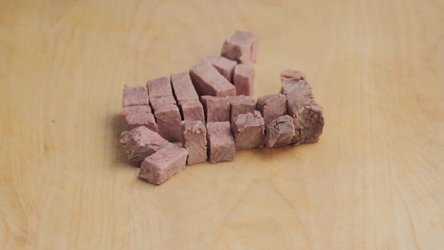 Cooked beef being diced
