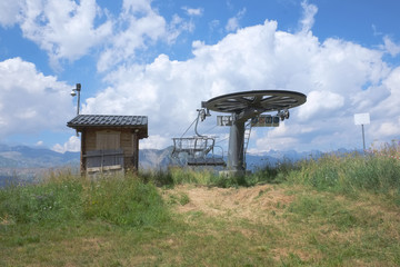 alpine chair lift in a summer landscape