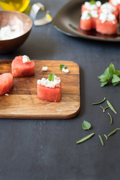 Heart-shaped watermelon with feta cheese and mint leaves. Selective focus