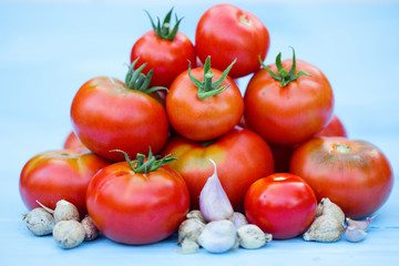 A lot of red tomatoes and garlic.